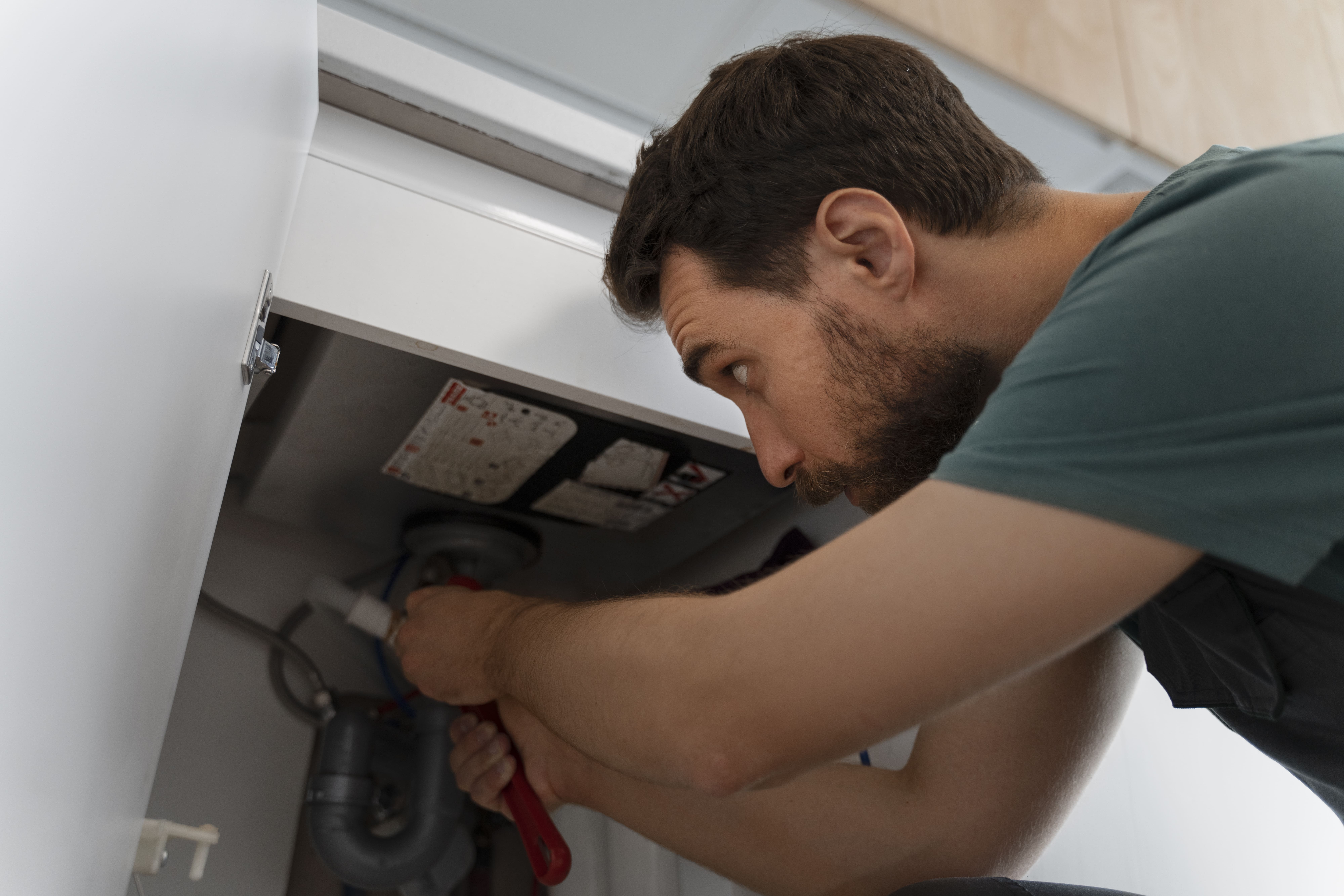 Low angle man working as plumber