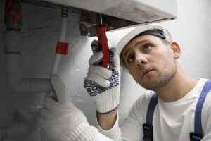 Worker repairing water heater (3)