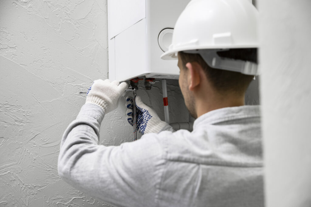 Worker repairing water heater (4)